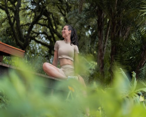 Woman meditating in nature finding emotional balance